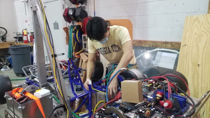 A RoboRacing member works on Rigatoni